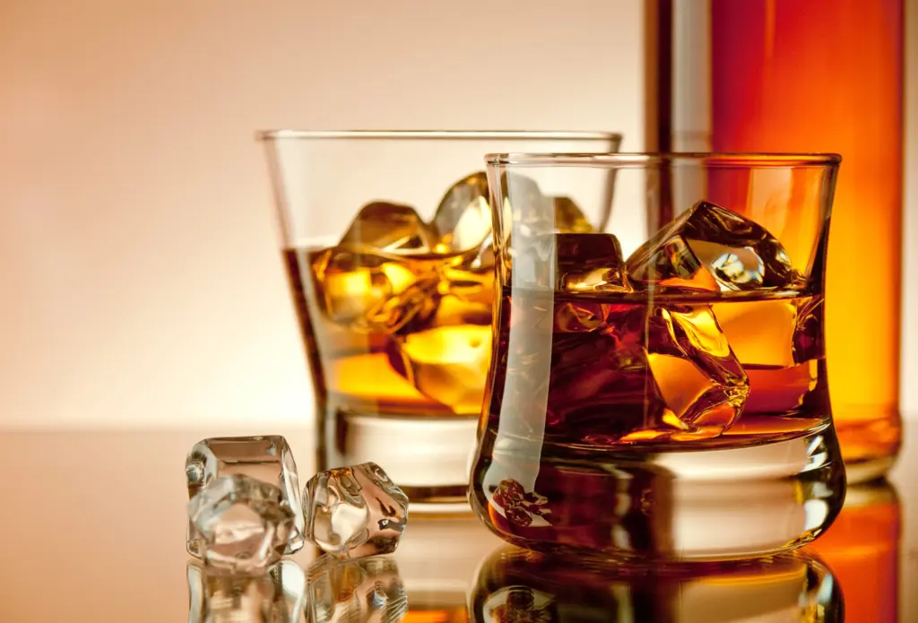 whiskey glasses with ice and liquor bottle 2026 01 07 01 34 00 utc (1)