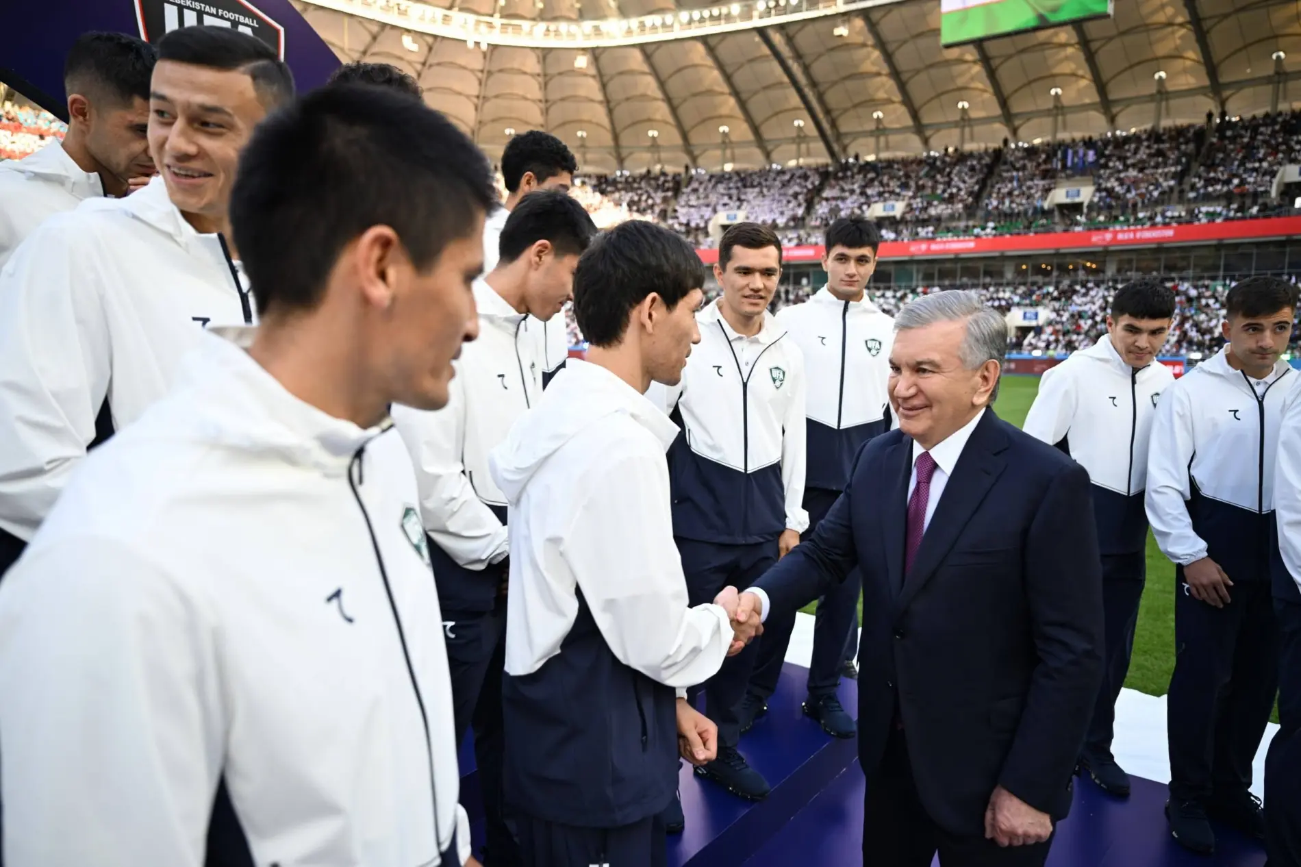 President congratulating players