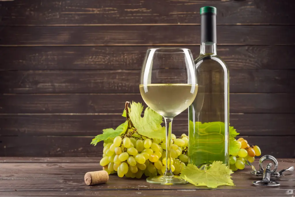 white wine and grapes on dark wooden surface 2026 03 23 23 42 22 utc (1)